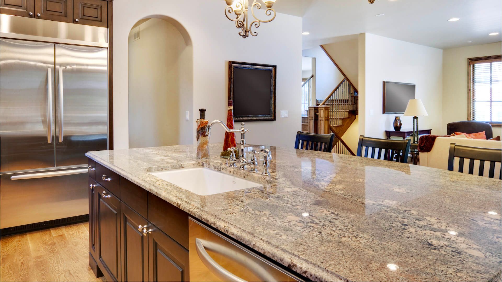 A modern and elegant kitchen showcasing Orlando granite countertops with subtle patterns and colors.